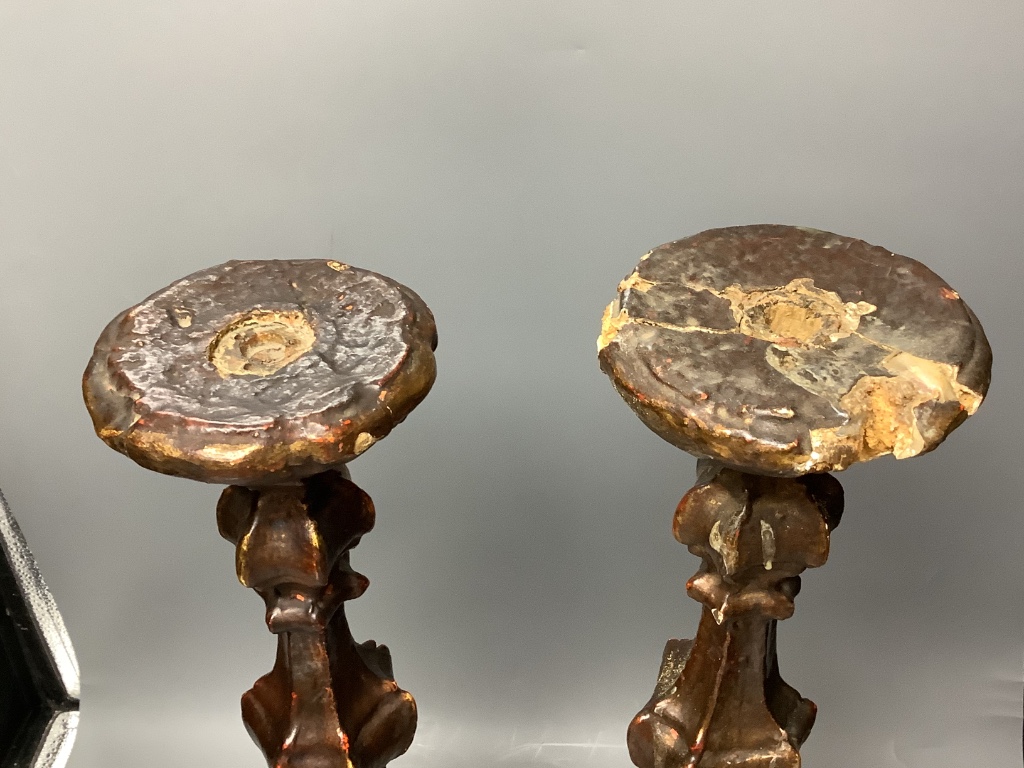 A pair of Italian Baroque style giltwood candlesticks 55cm